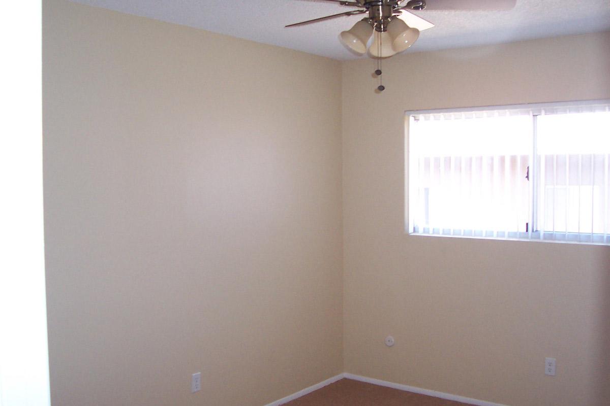 a white sink sitting under a window