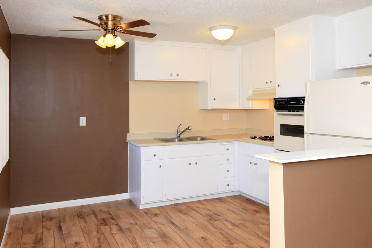 a large white refrigerator in a kitchen