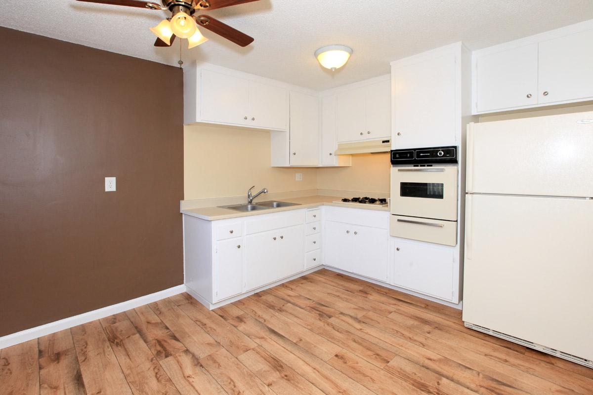 a kitchen with a wood floor