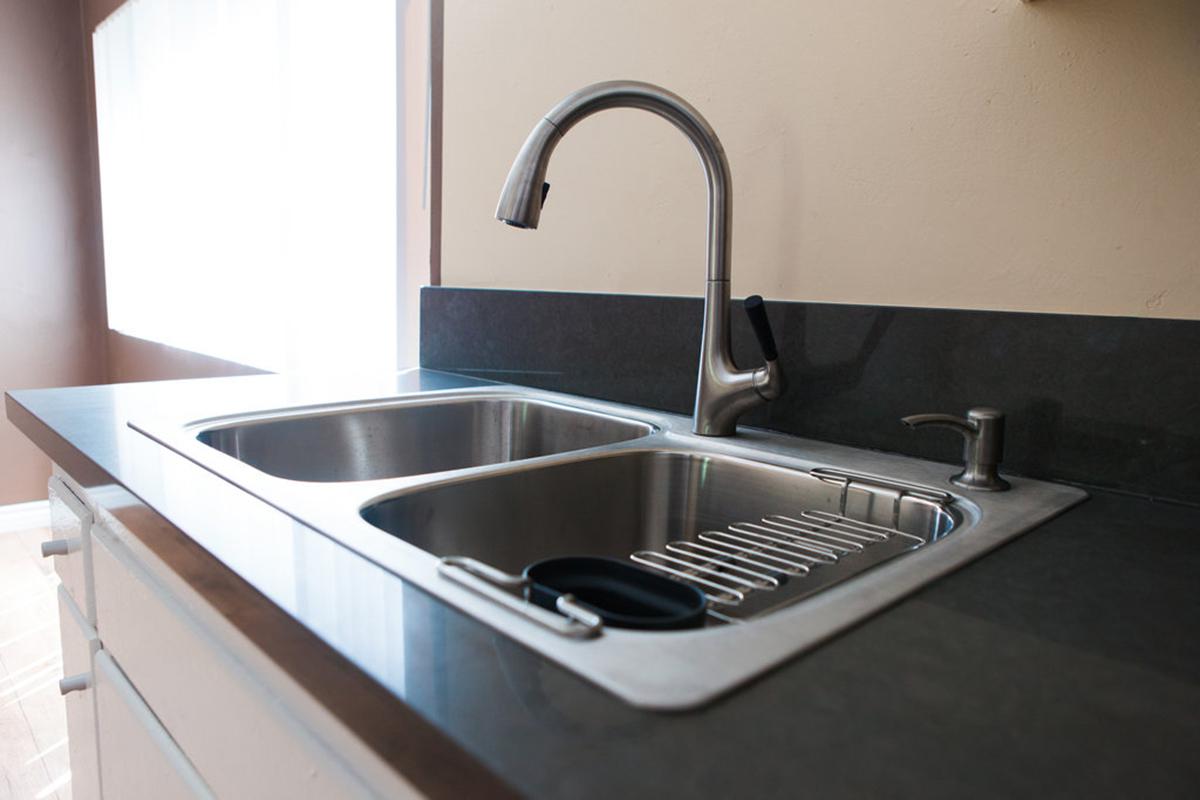 a kitchen with a stove and a sink