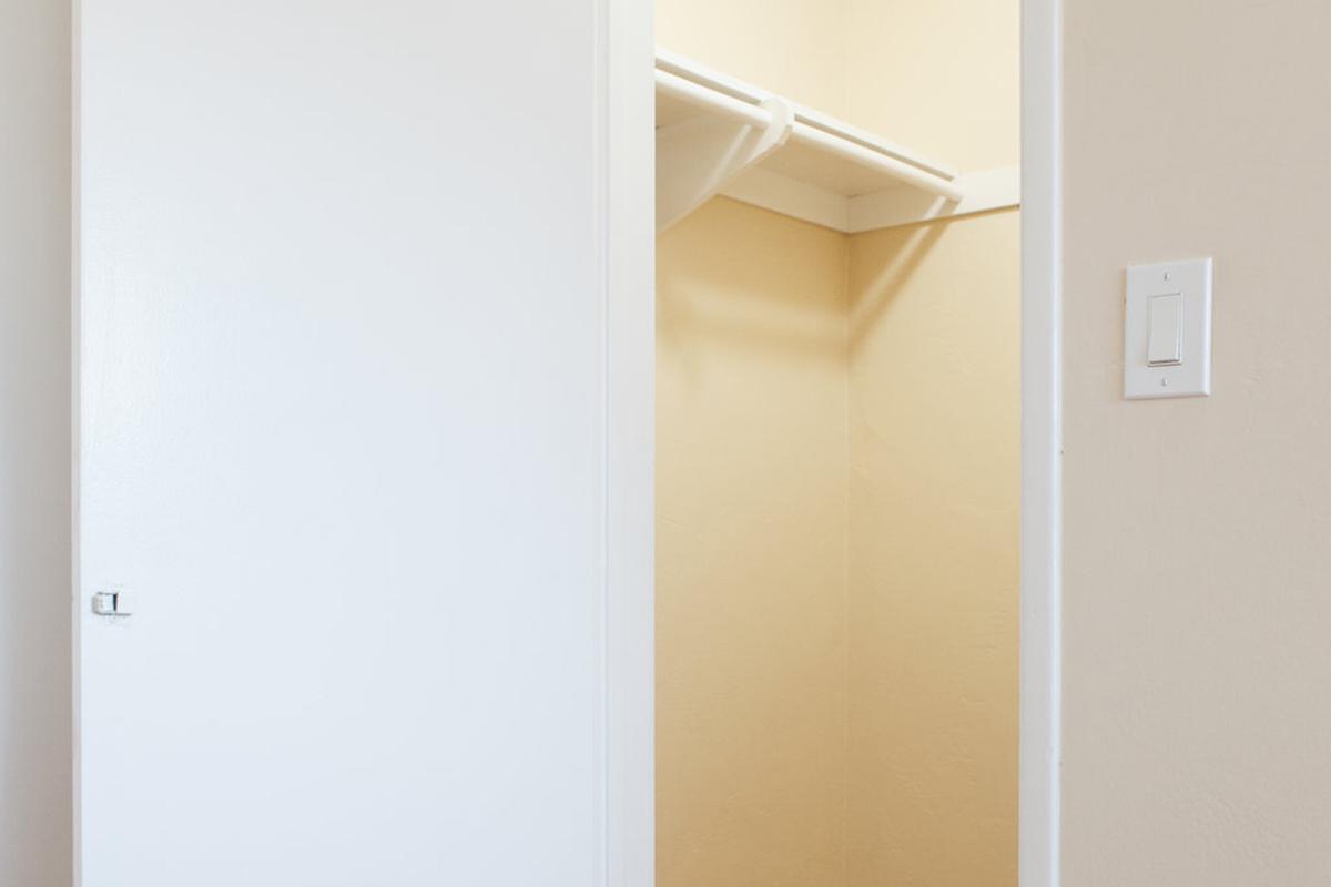 a white refrigerator freezer sitting next to a door