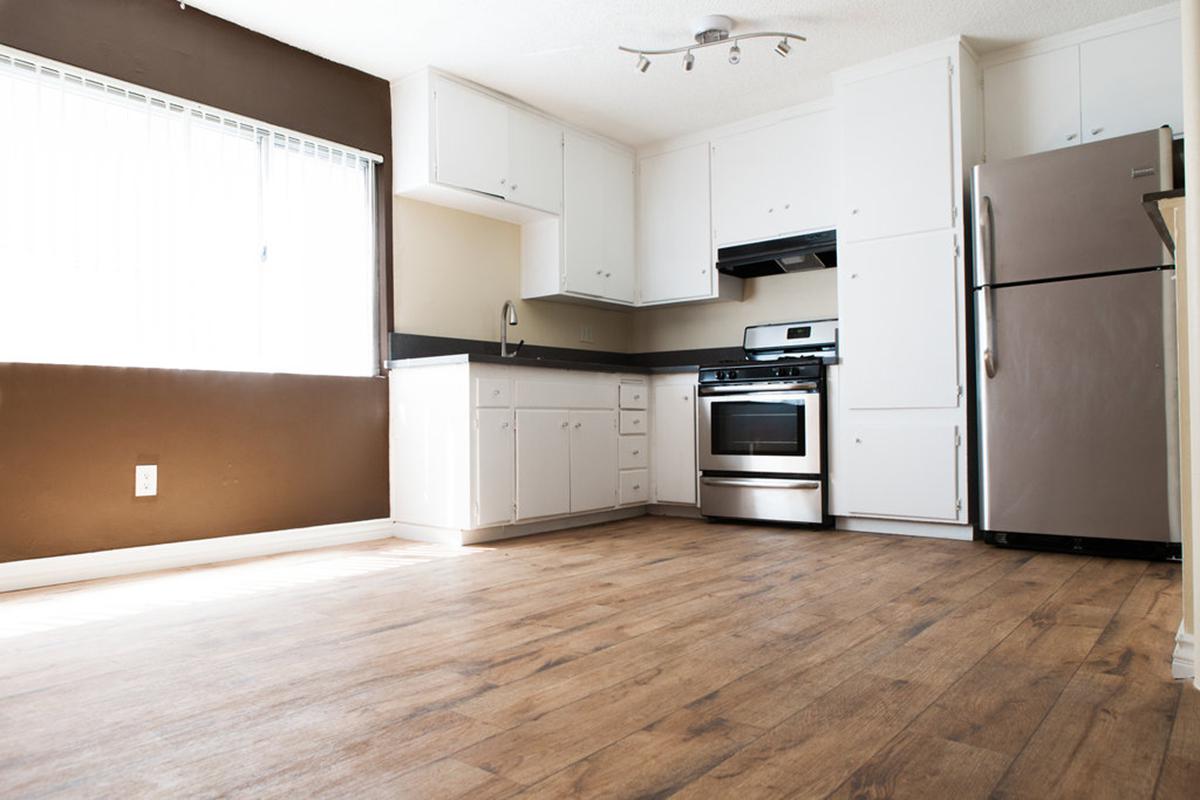 a large white refrigerator in a kitchen