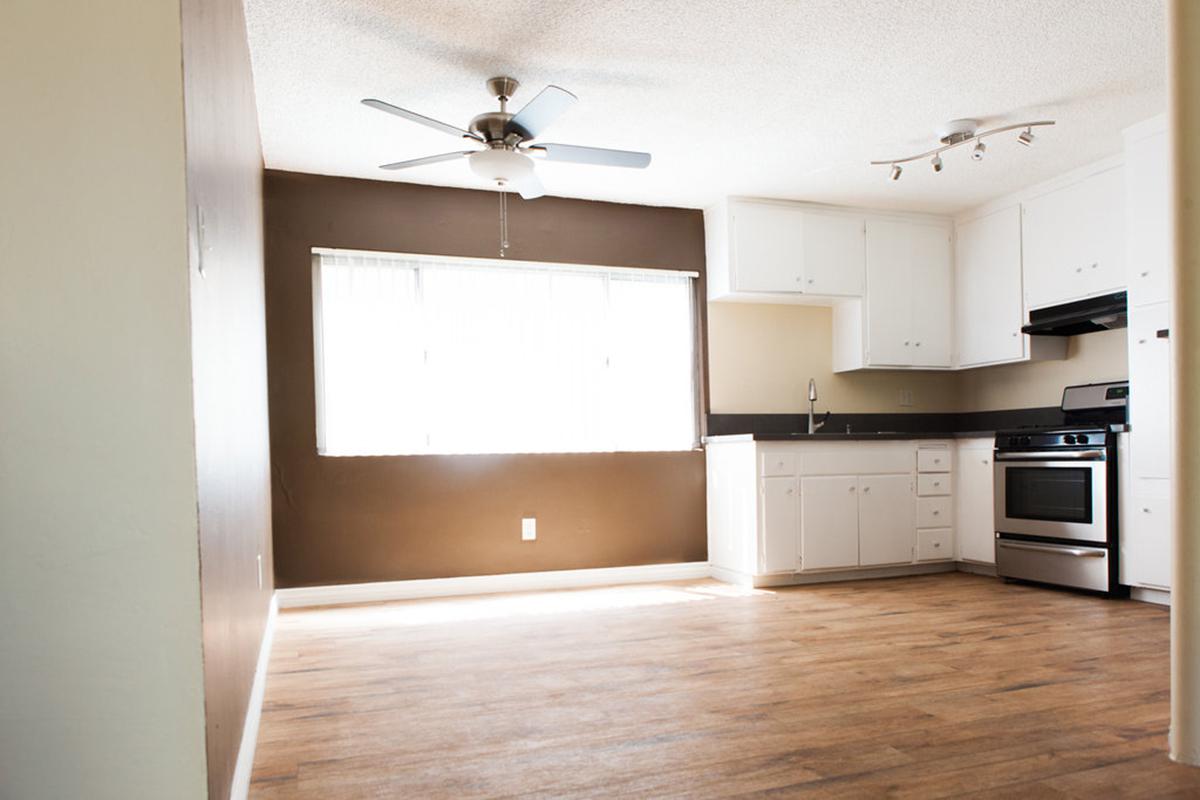 a kitchen with a wood floor