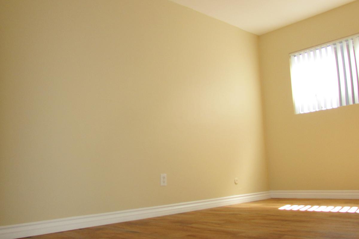 a bedroom with a large window