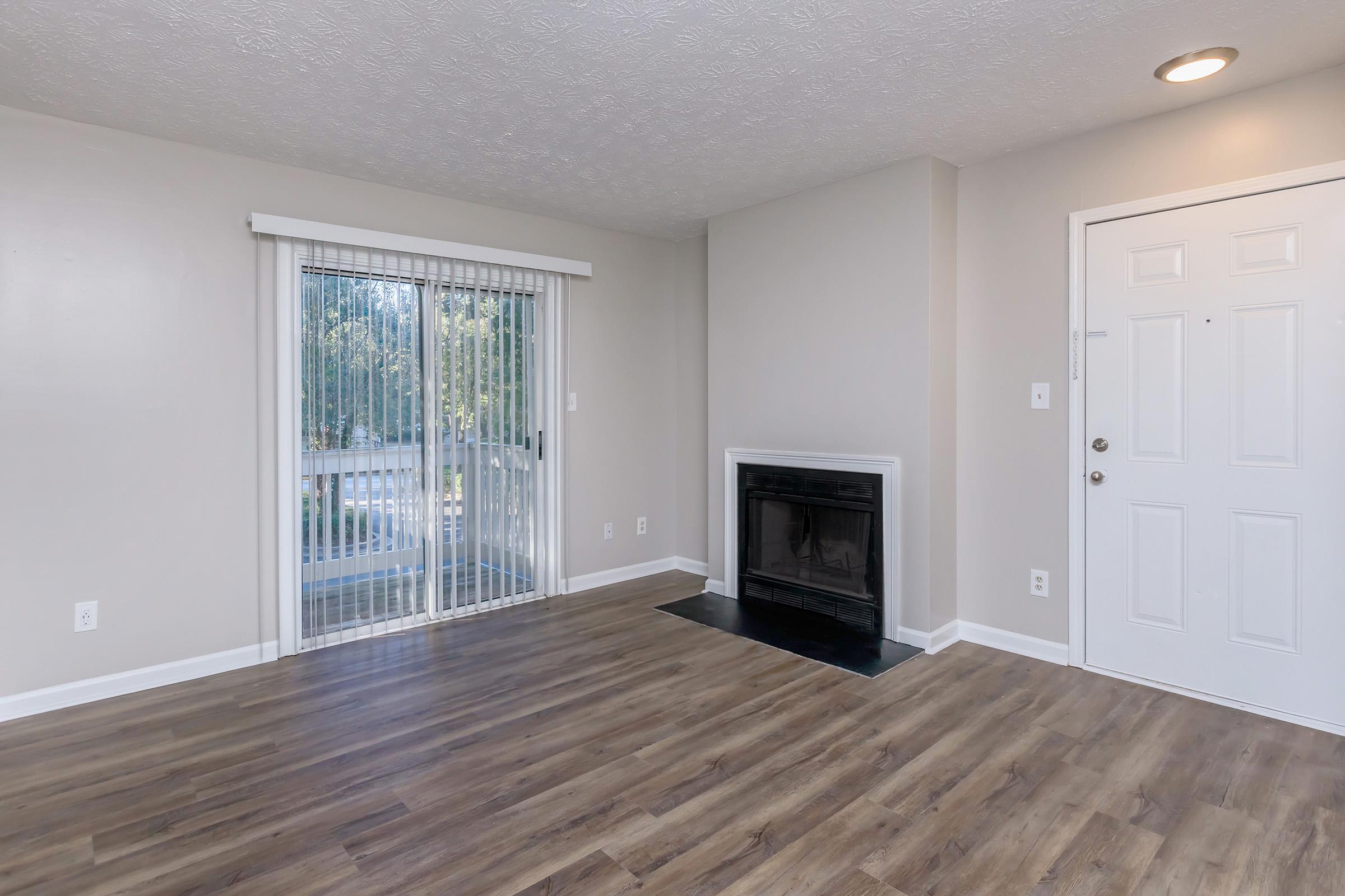 a view of a living room with a wood floor