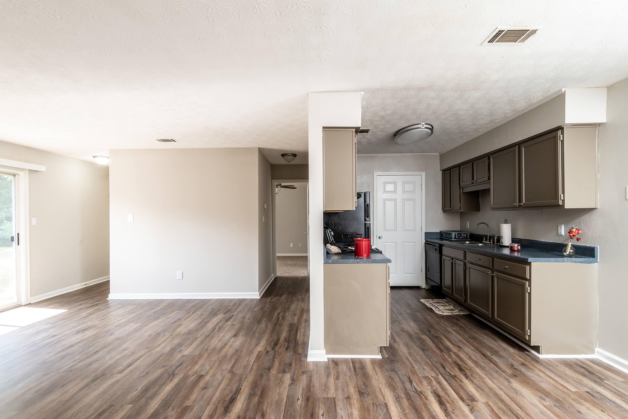 a kitchen with a wood floor