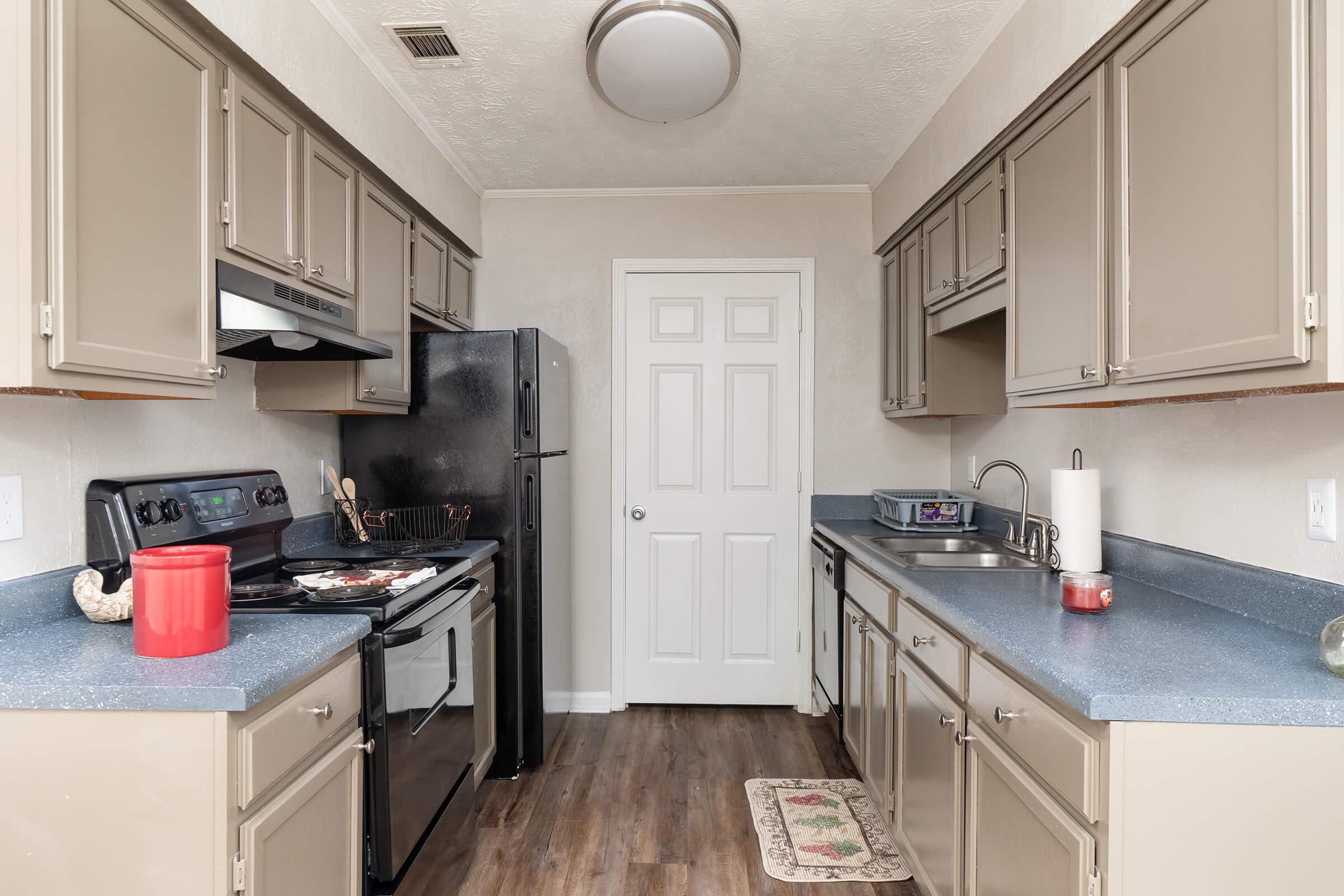 a kitchen with a stove and a sink