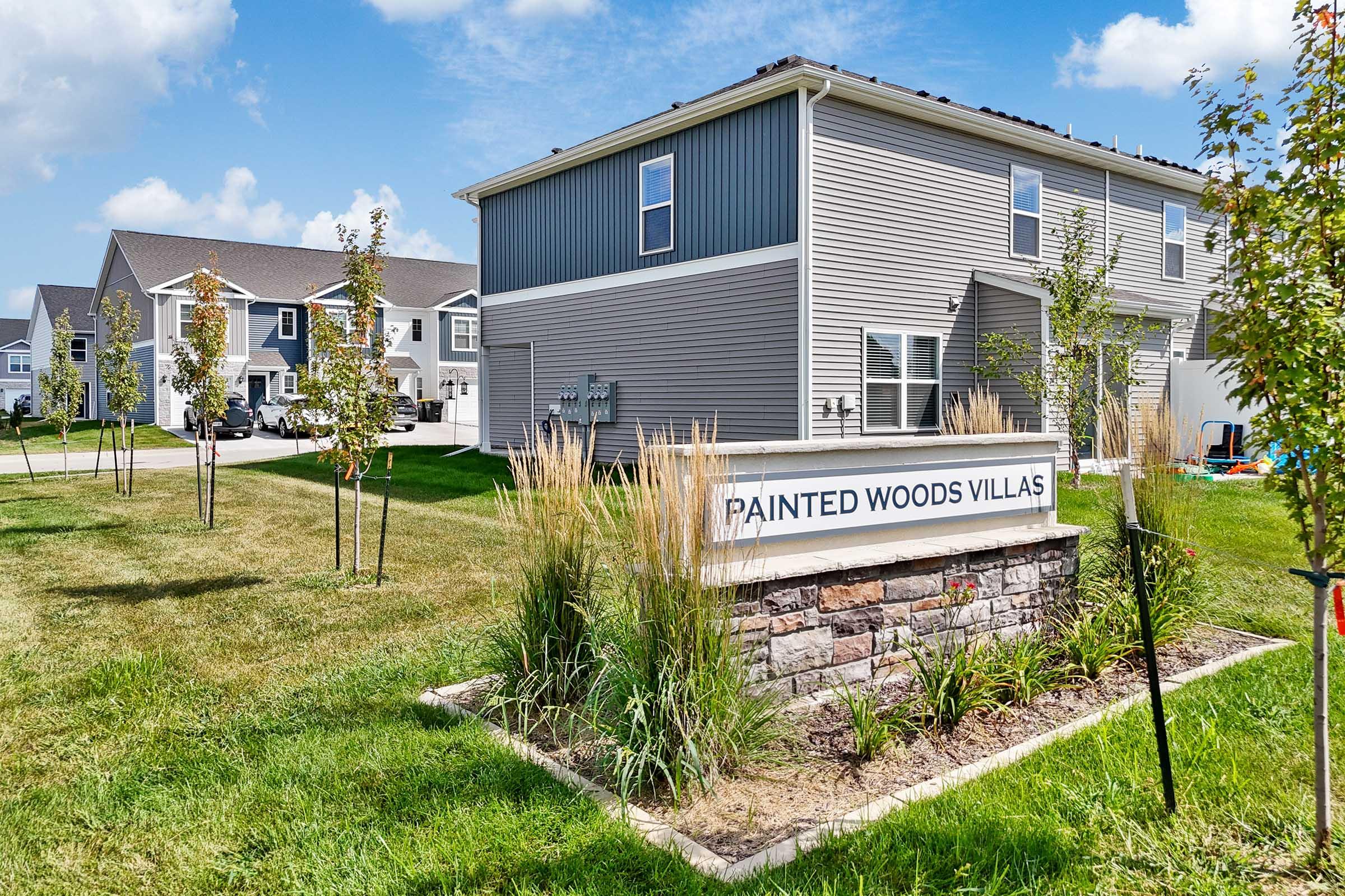 New construction townhomes for rent at Painted Woods Villas in Waukee, IA with private attached garages.