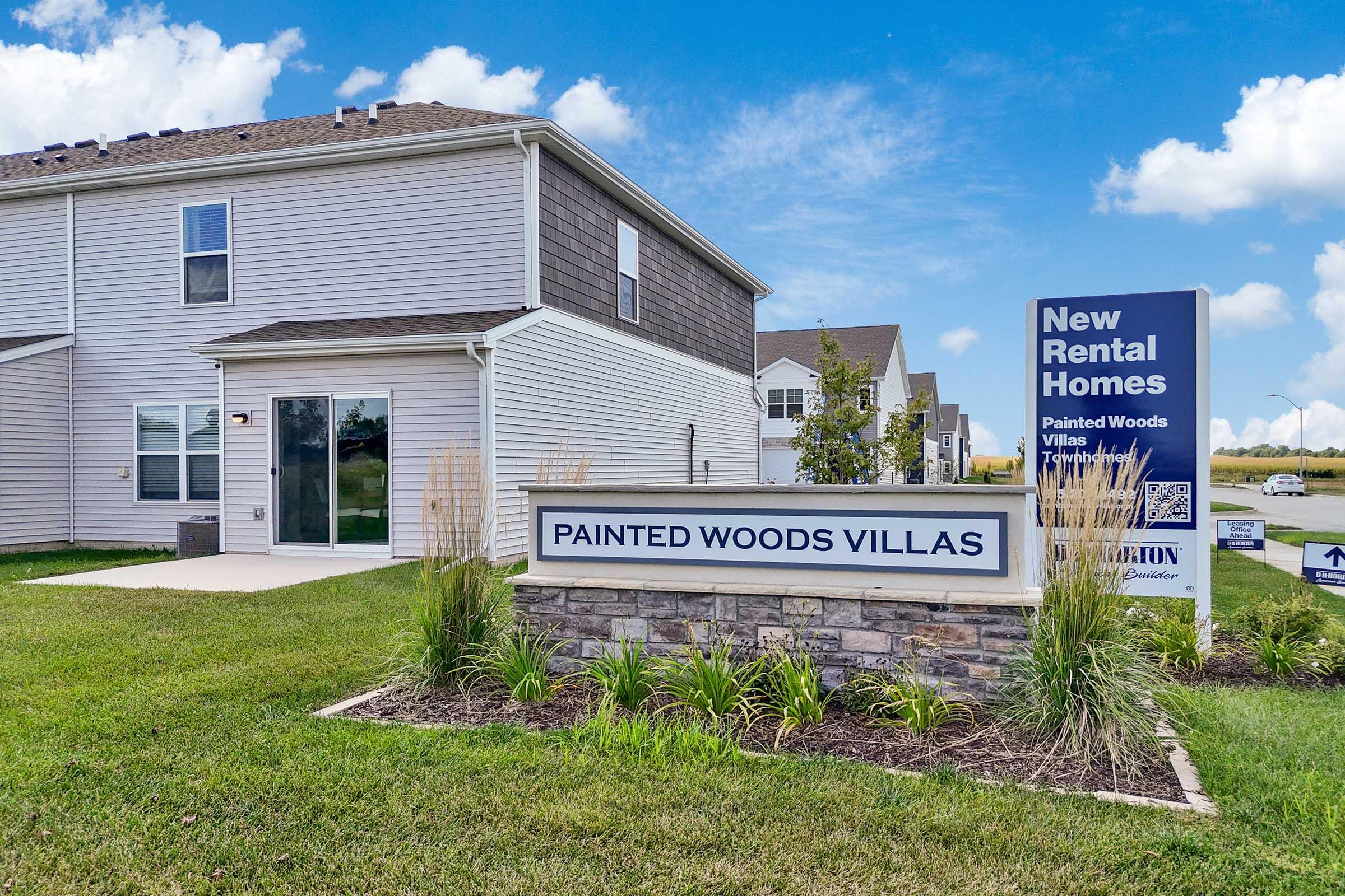 Painted Woods Villas entrance sign for newly built townhomes in Waukee near West Des Moines.