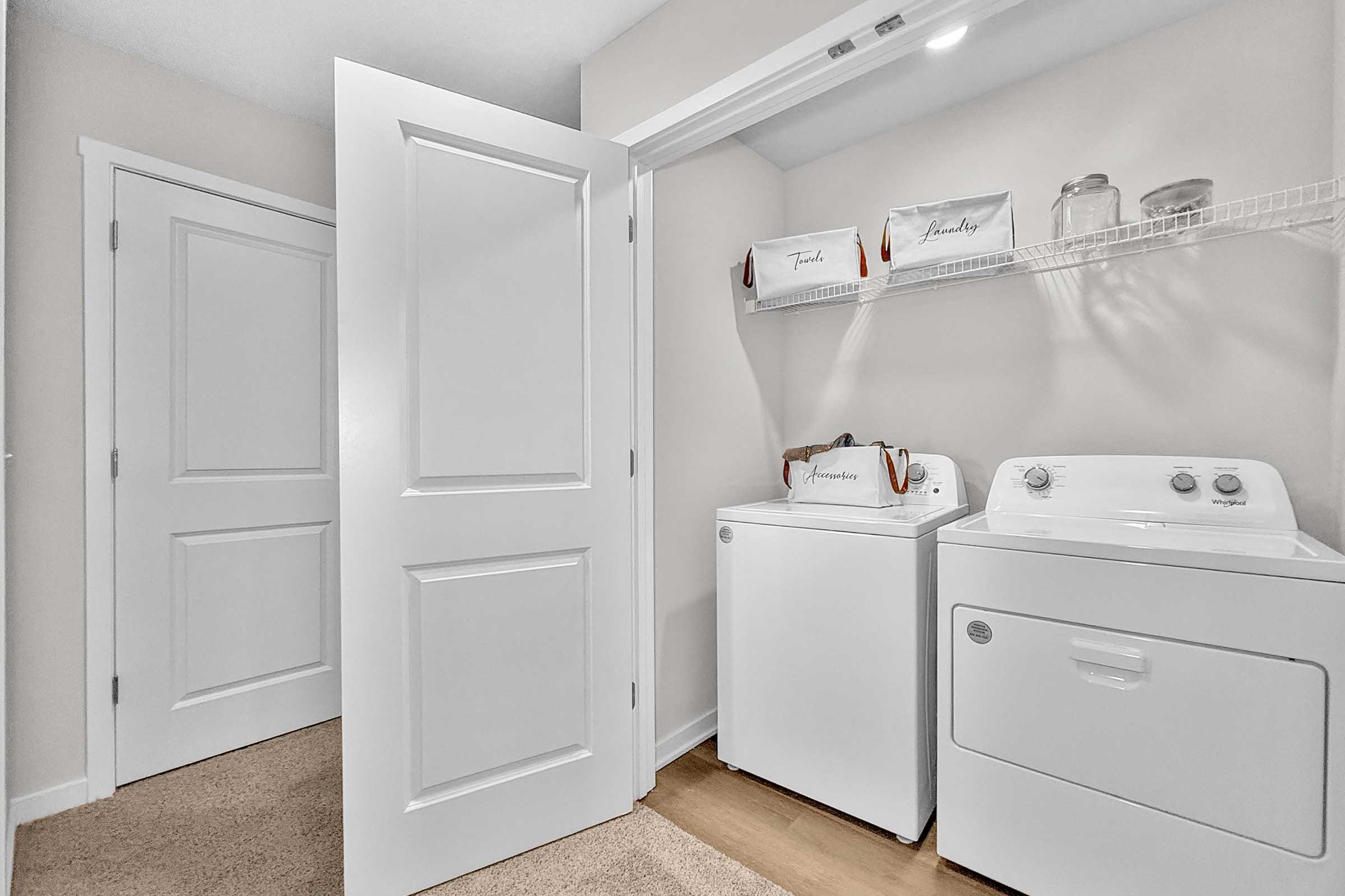 In-unit laundry with washer and dryer in three-bedroom Painted Woods Villas townhome for rent.