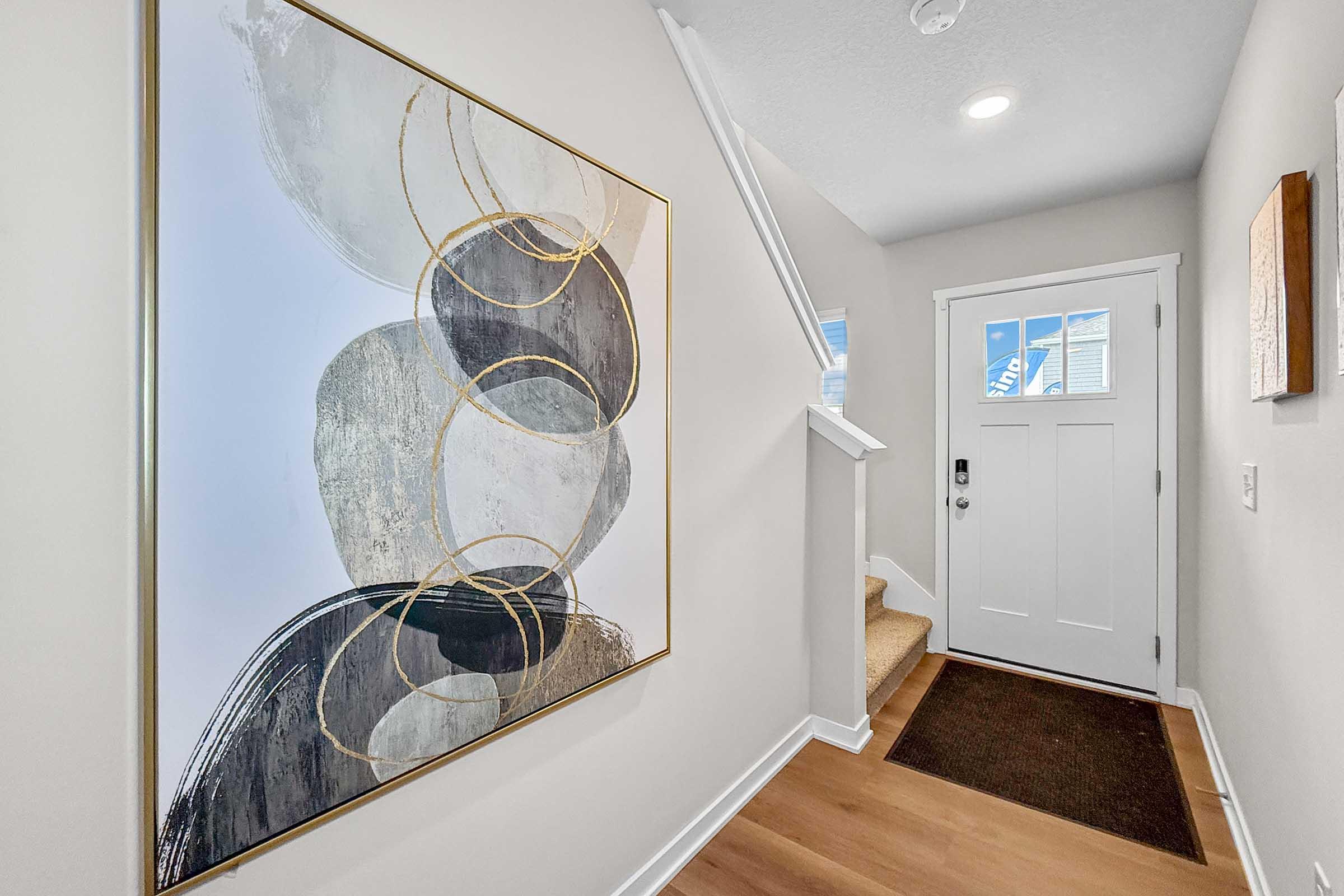 Entryway of new two-story townhome at Painted Woods Villas in Waukee, IA with modern finishes.