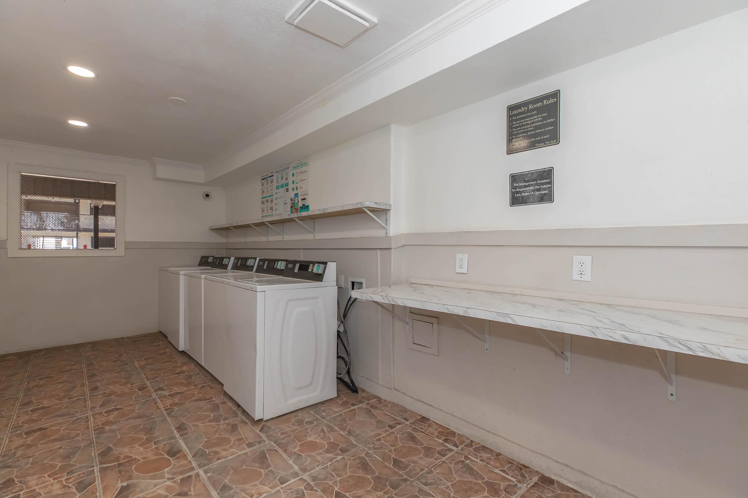 a kitchen with a sink and a refrigerator