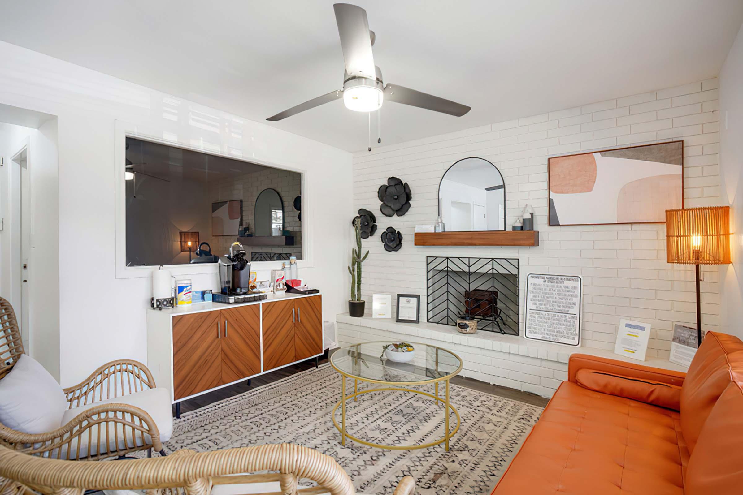 a living room filled with furniture and a fireplace