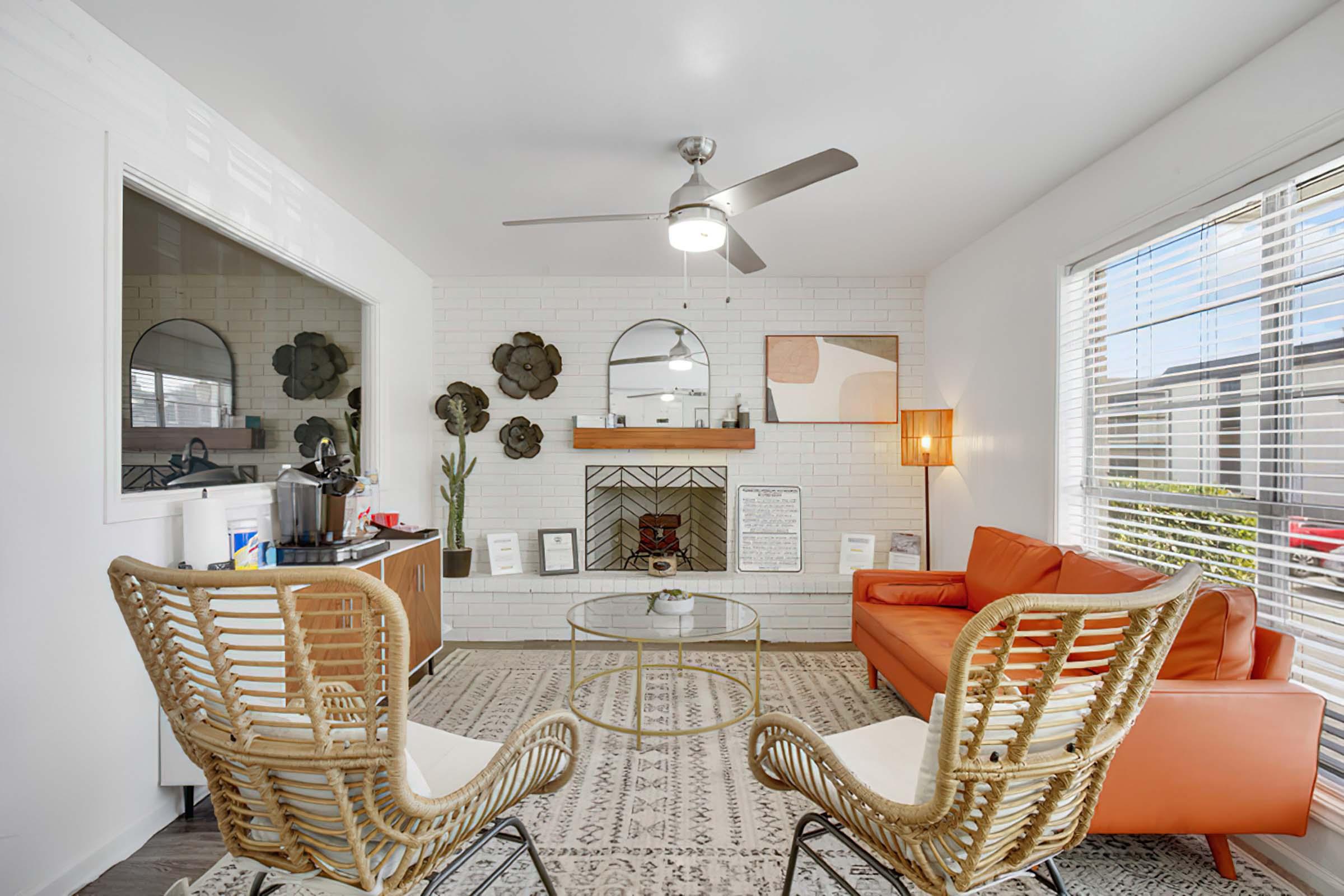 a living room filled with furniture and a fire place