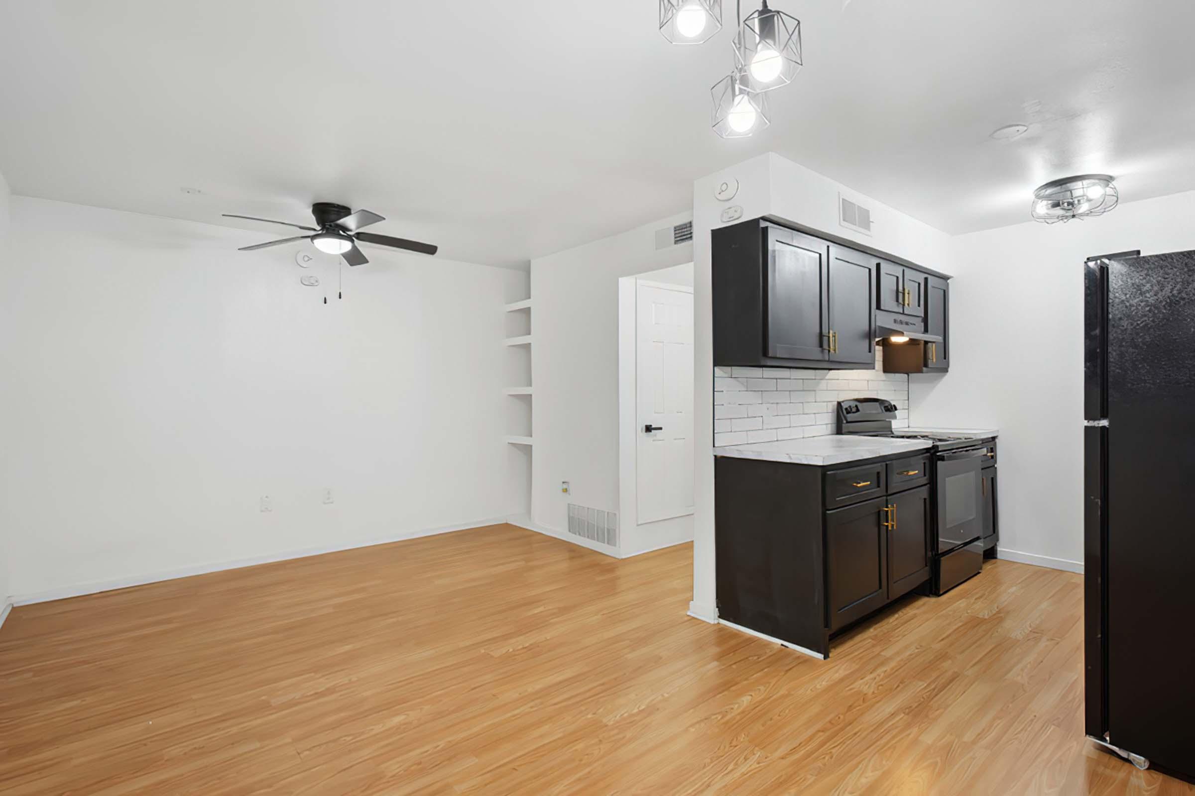 a large kitchen with stainless steel appliances and wooden cabinets