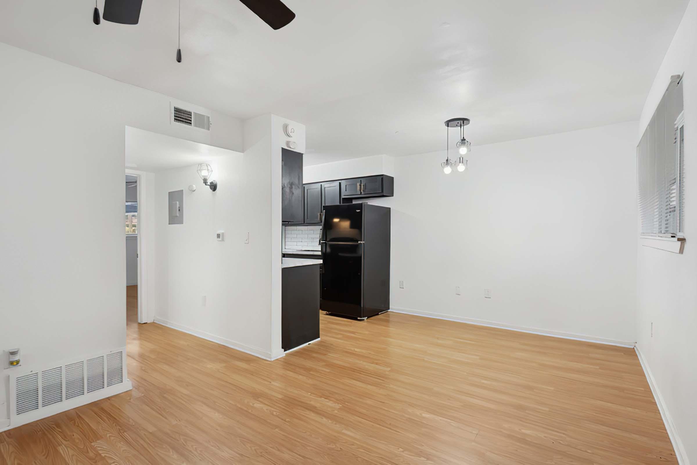 a kitchen with a wood floor