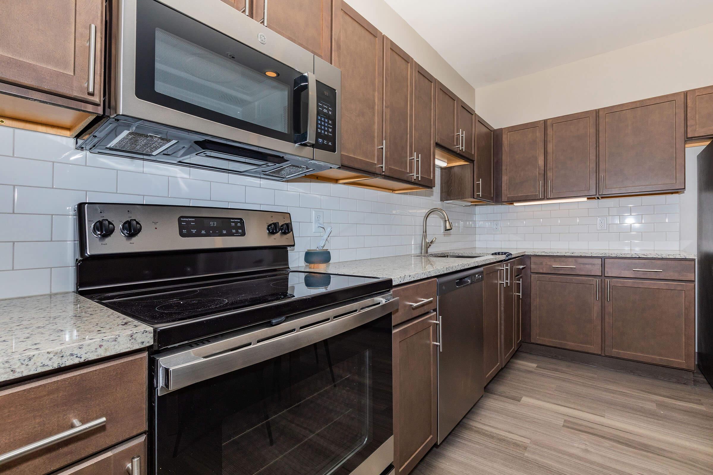 a kitchen with a stove top oven