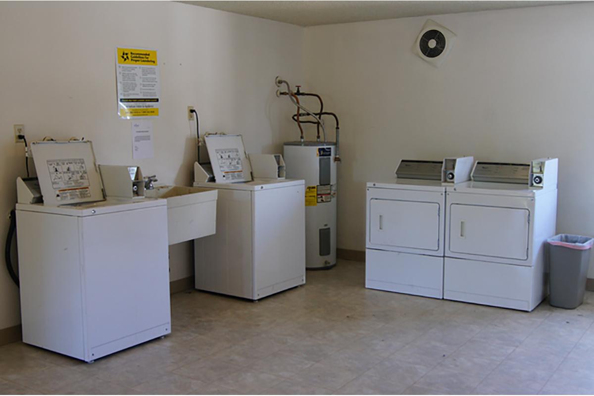 a white refrigerator freezer sitting inside of a kitchen