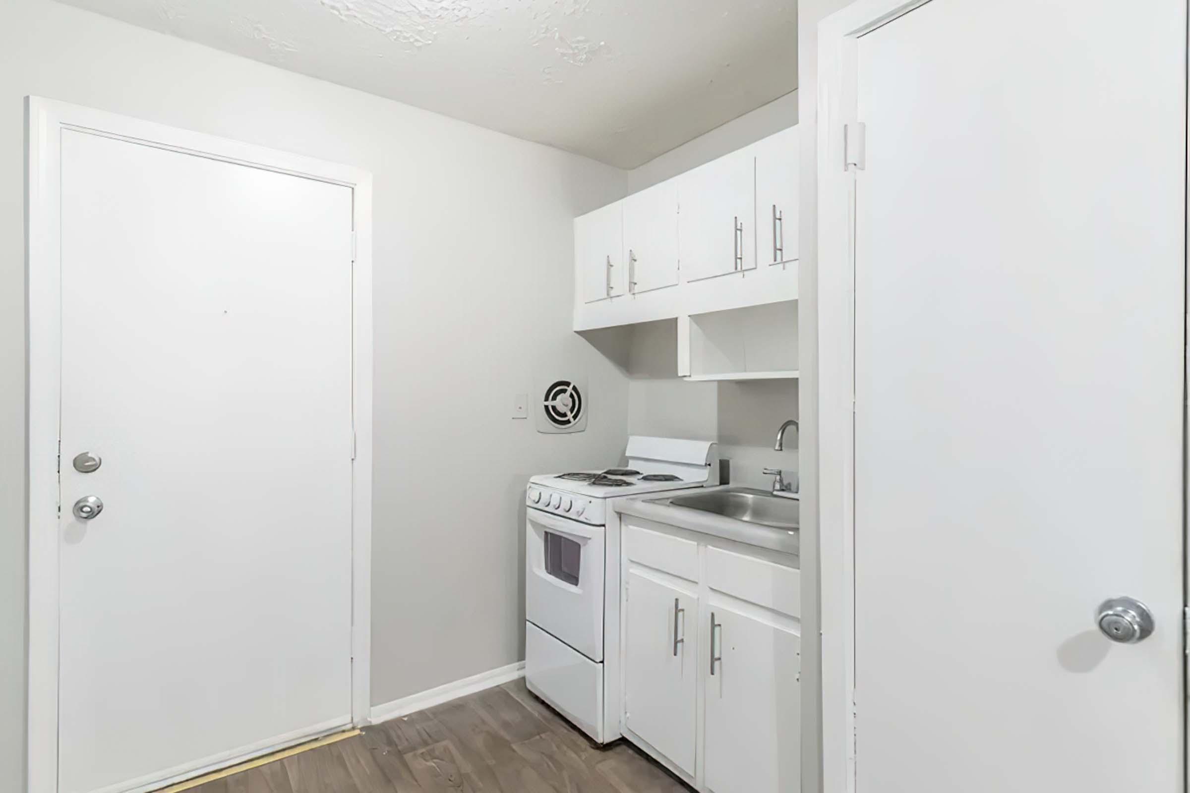 a kitchen with a sink and a microwave