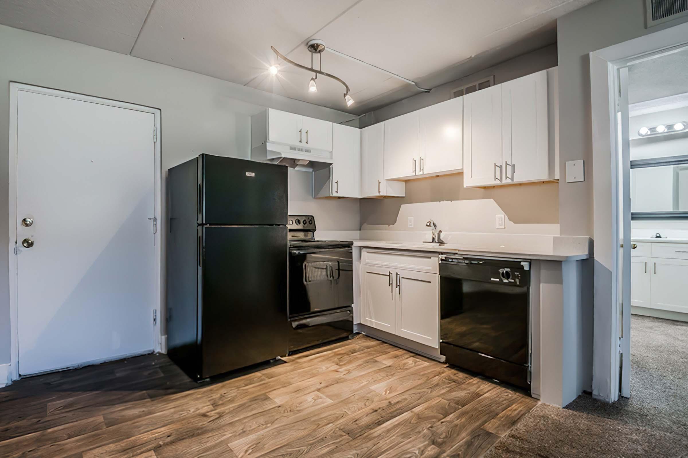 a large kitchen with stainless steel appliances