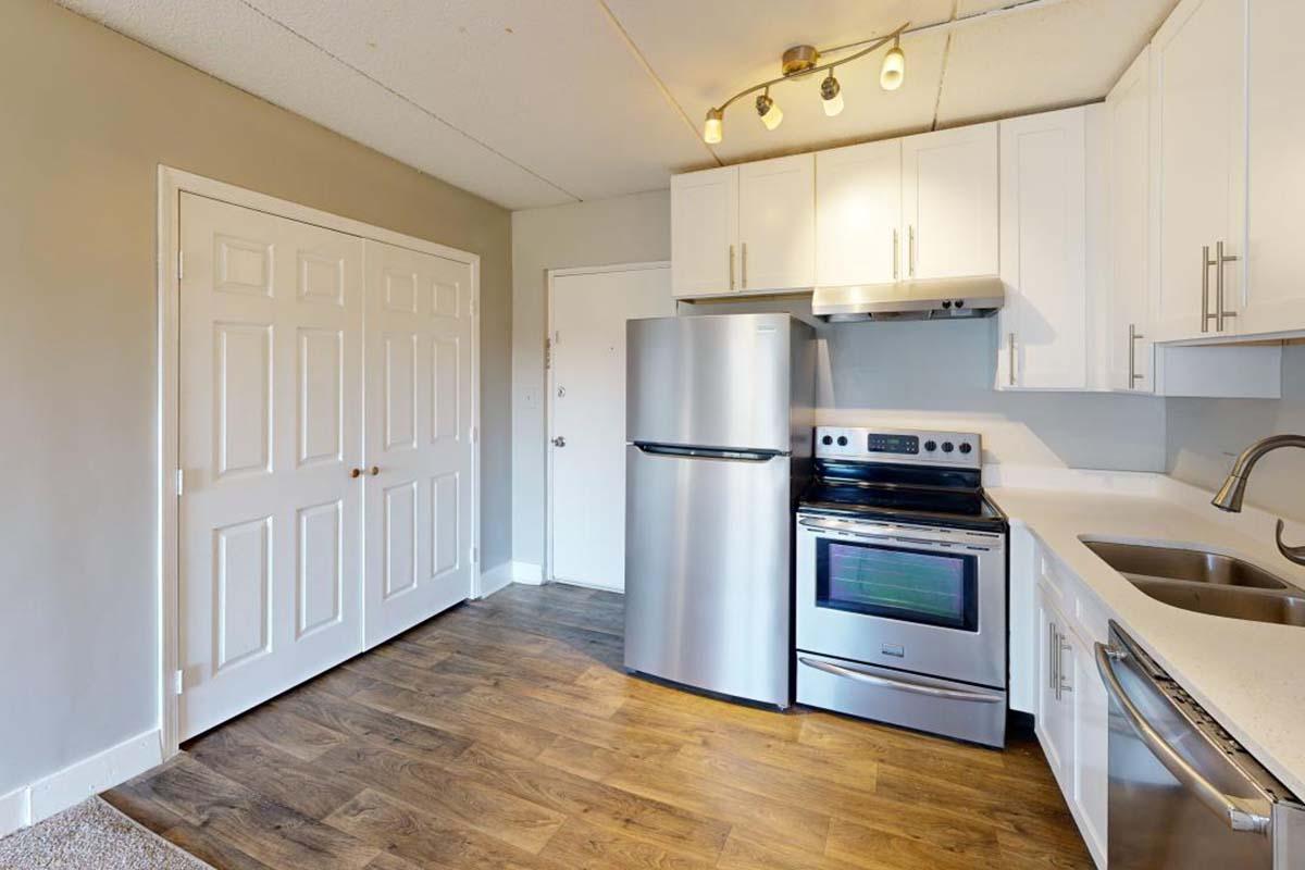 a kitchen with a stove and a refrigerator