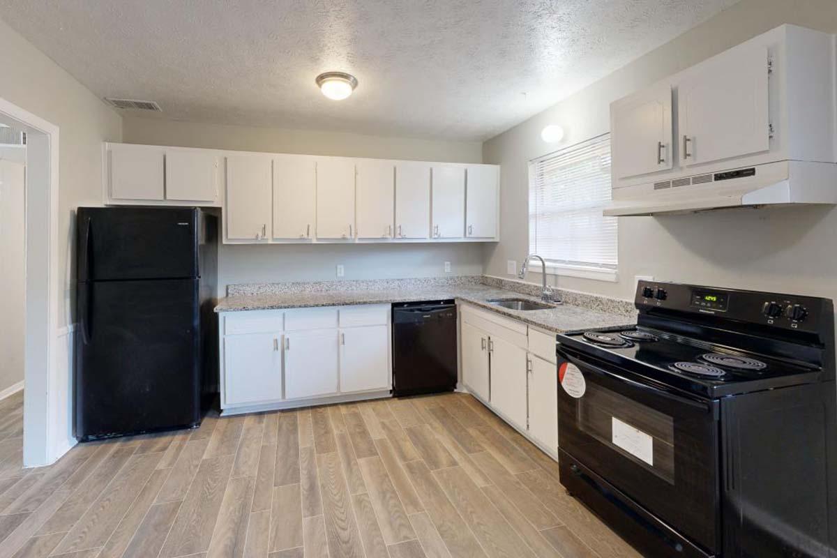 a large kitchen with stainless steel appliances