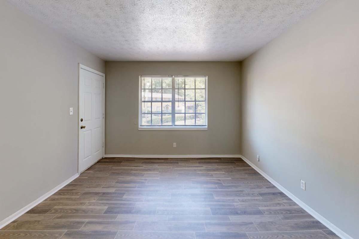 a large empty room with a tiled floor