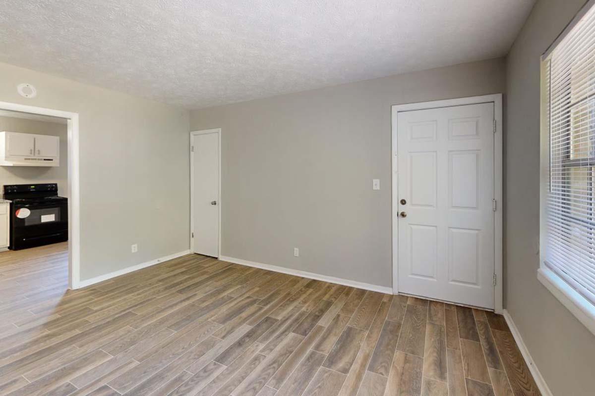 a kitchen with a hard wood floor