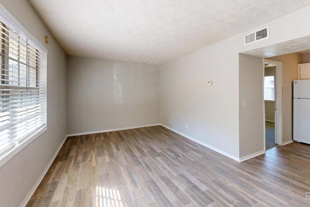 a large empty room with a wood floor