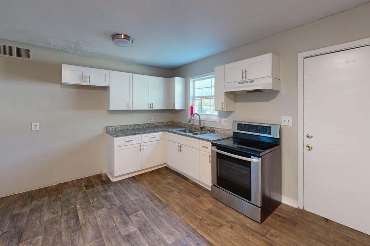 a kitchen with a wood floor