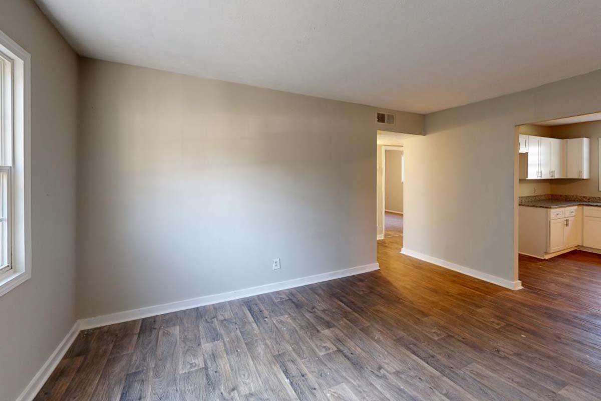 a flat screen tv mounted to the side of a hard wood floor