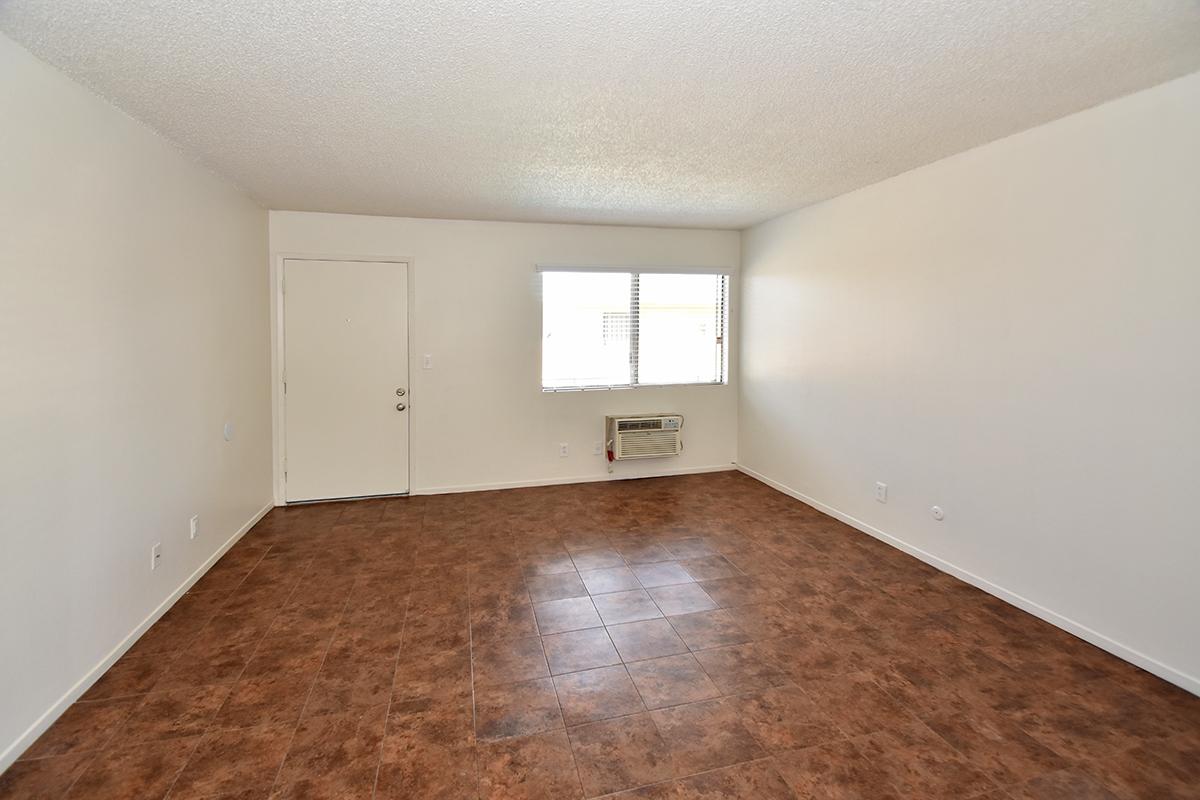 a large empty room with a wooden floor