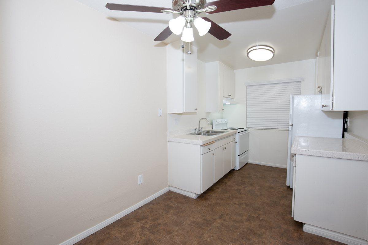 a white refrigerator freezer sitting inside of a kitchen