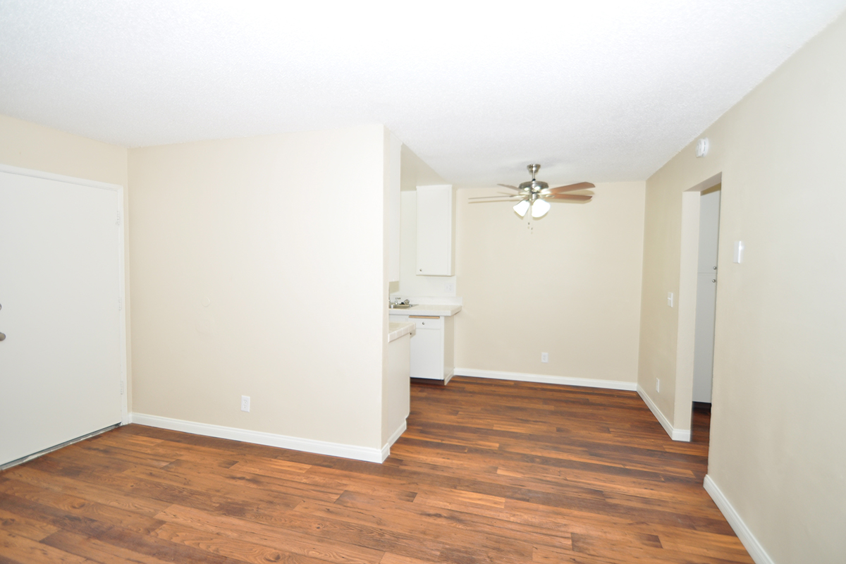 a kitchen with a hard wood floor