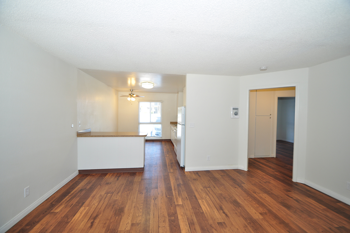 a kitchen with a hard wood floor