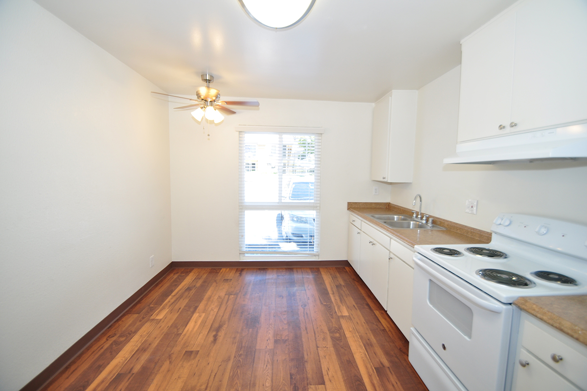 a kitchen with a wood floor