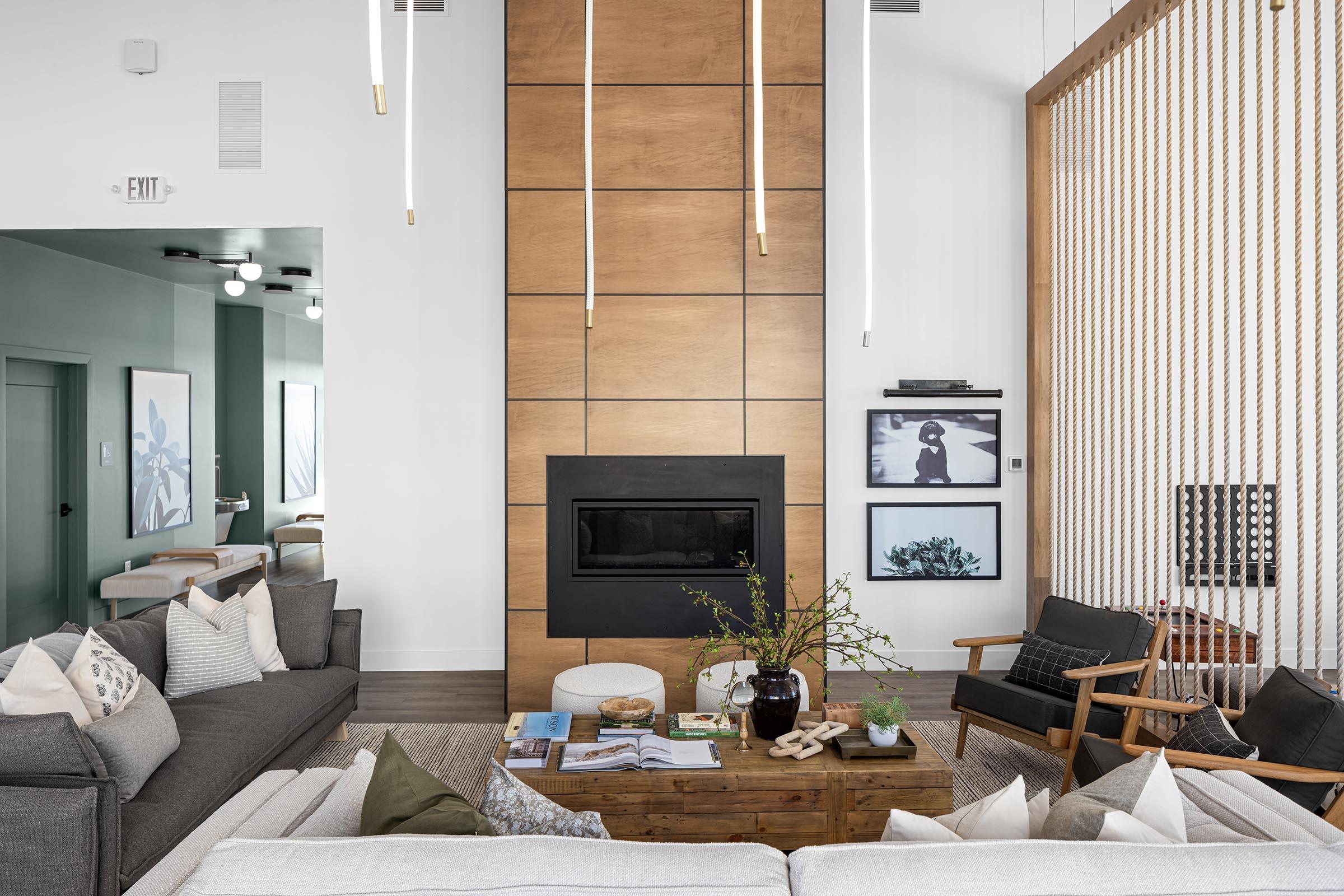 a living room filled with furniture and a large window