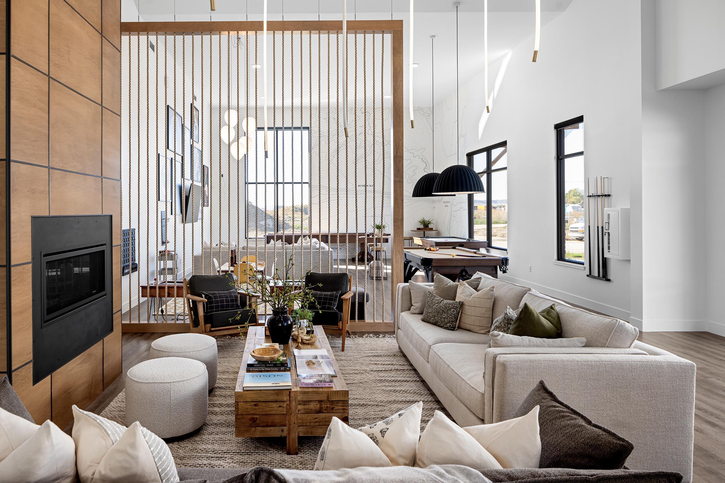 a living room filled with furniture and a large window