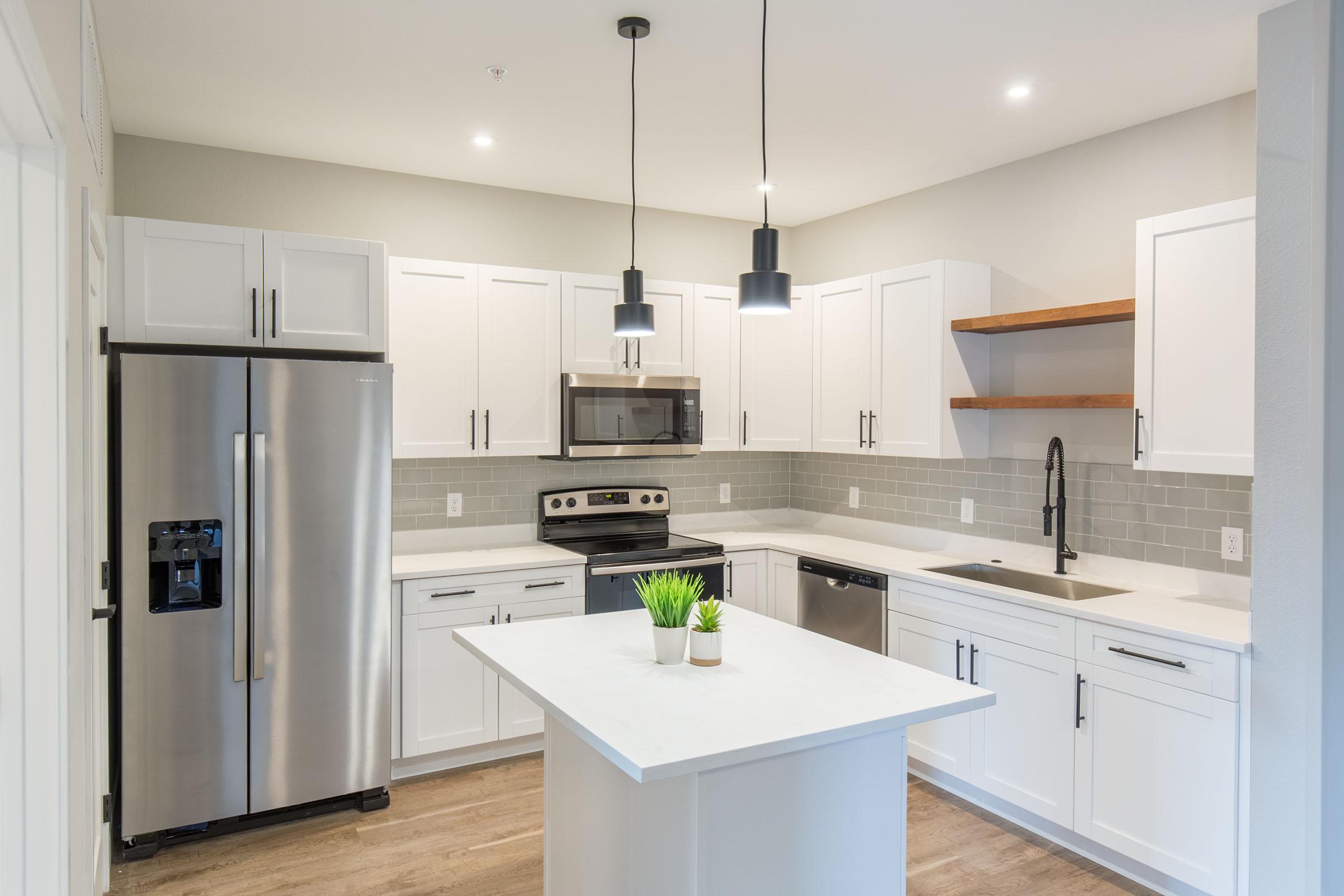 a modern kitchen with stainless steel appliances