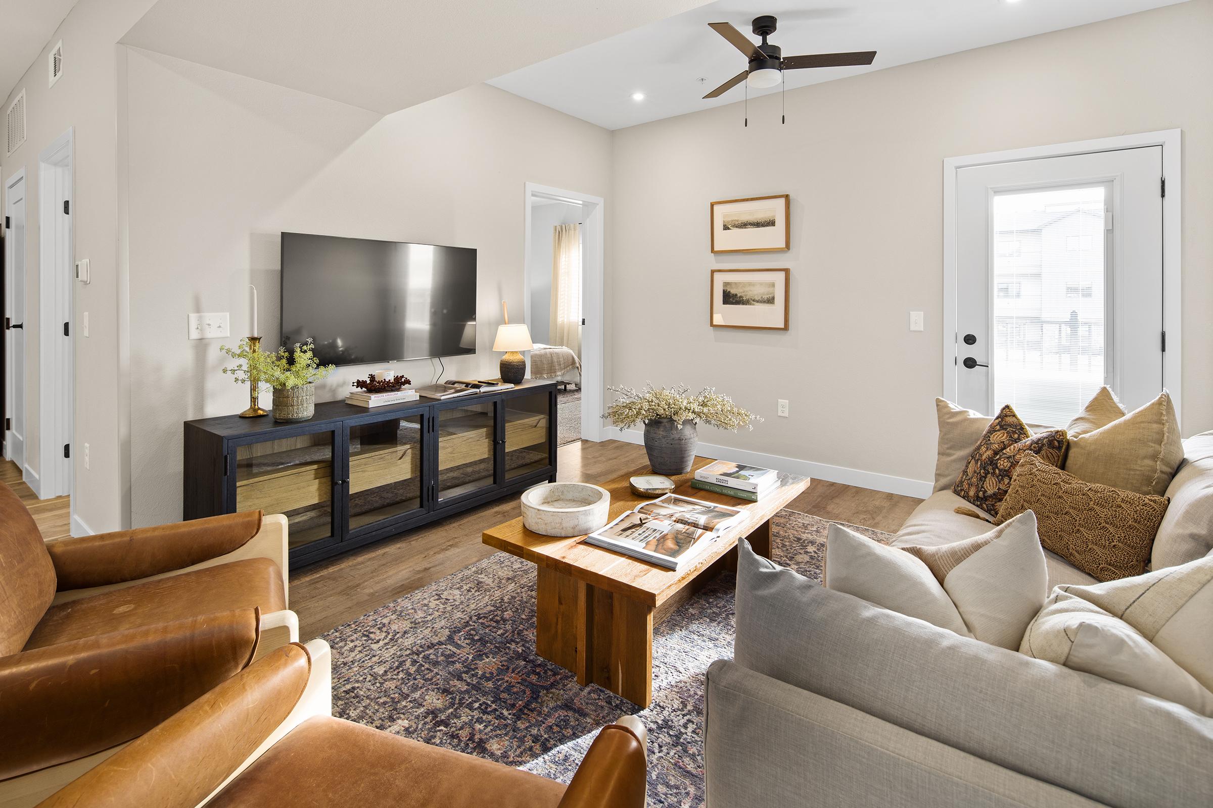 a living room filled with furniture and a fireplace