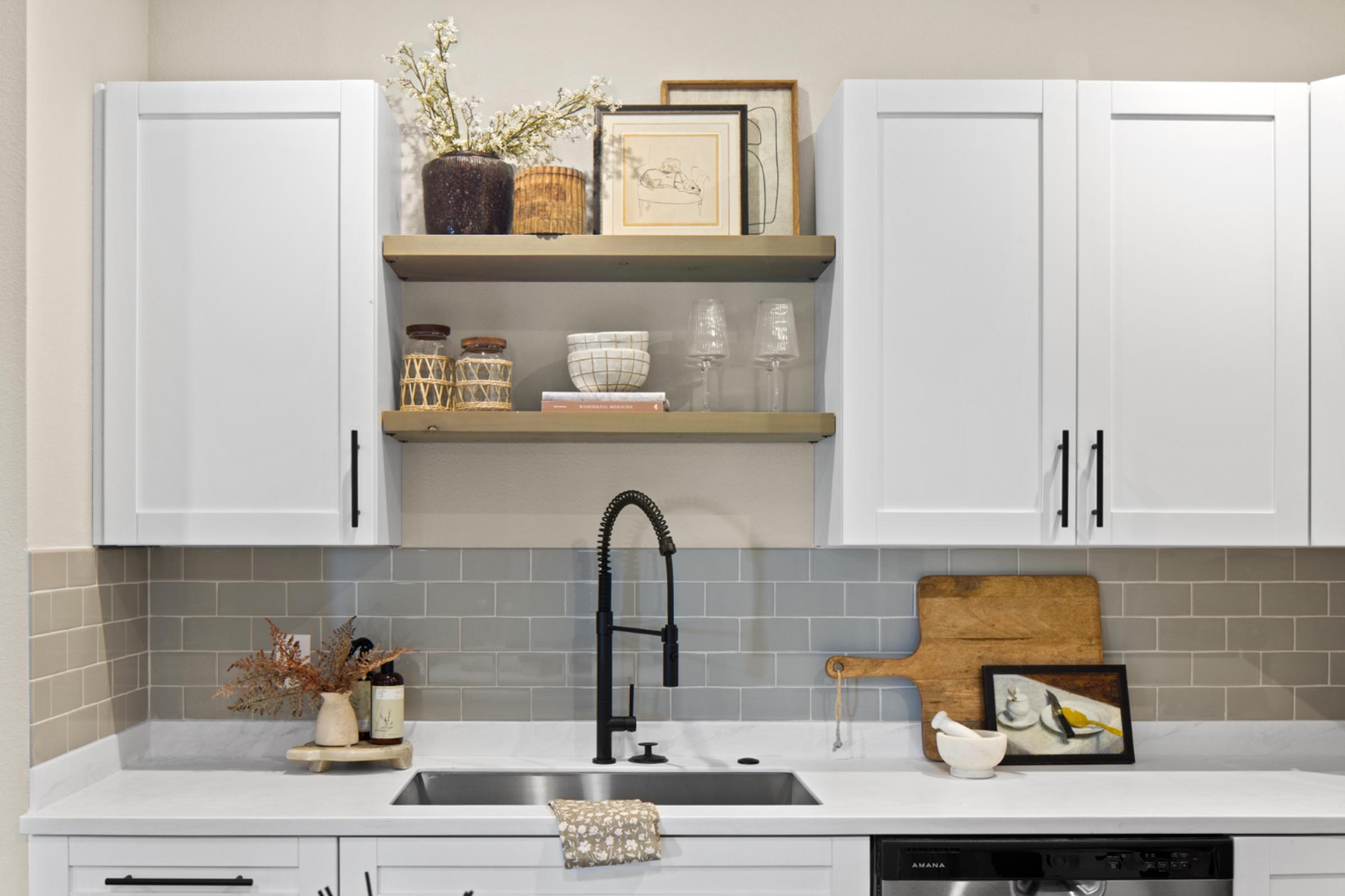 a kitchen with a sink and a microwave