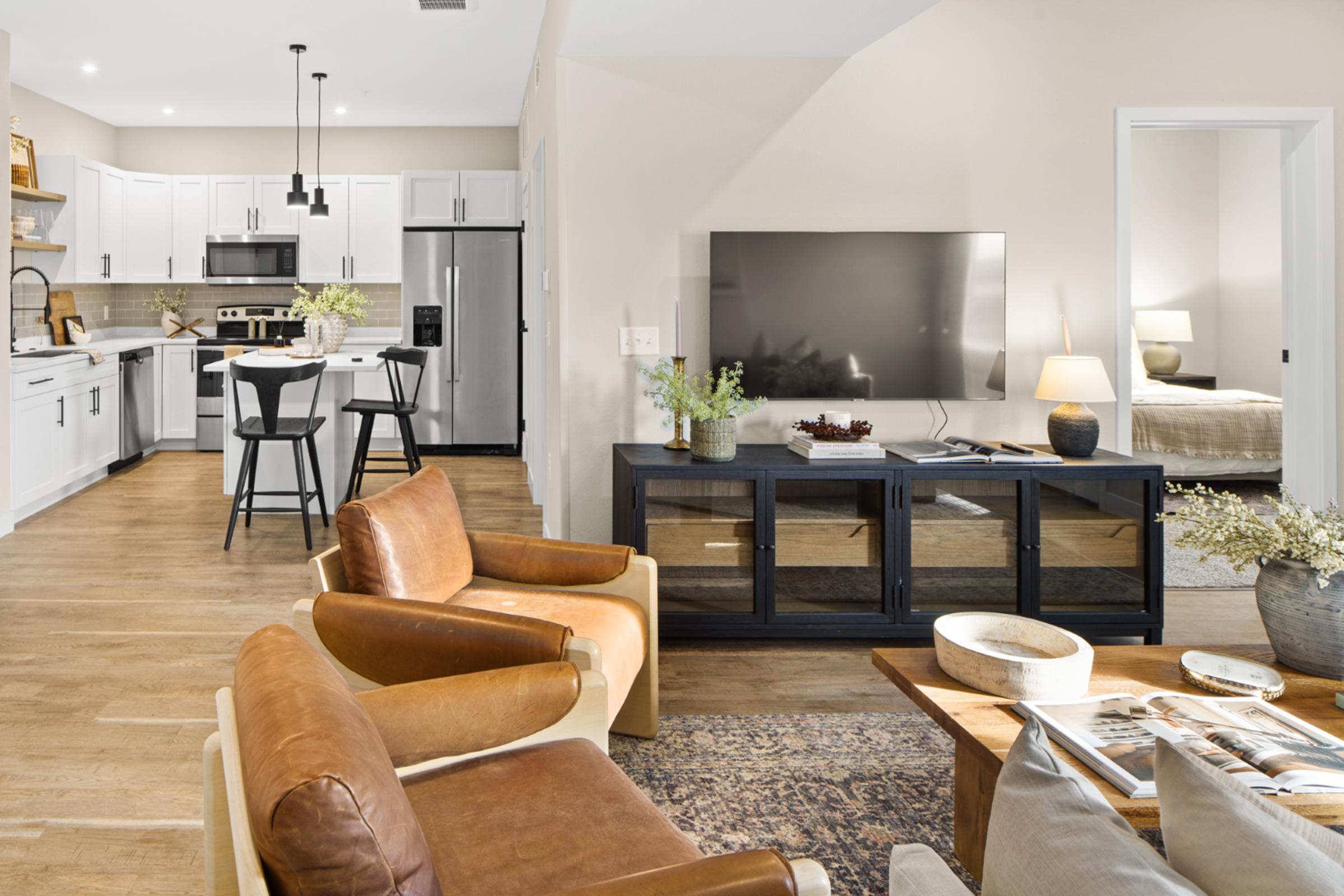 a living room filled with furniture and a fire place