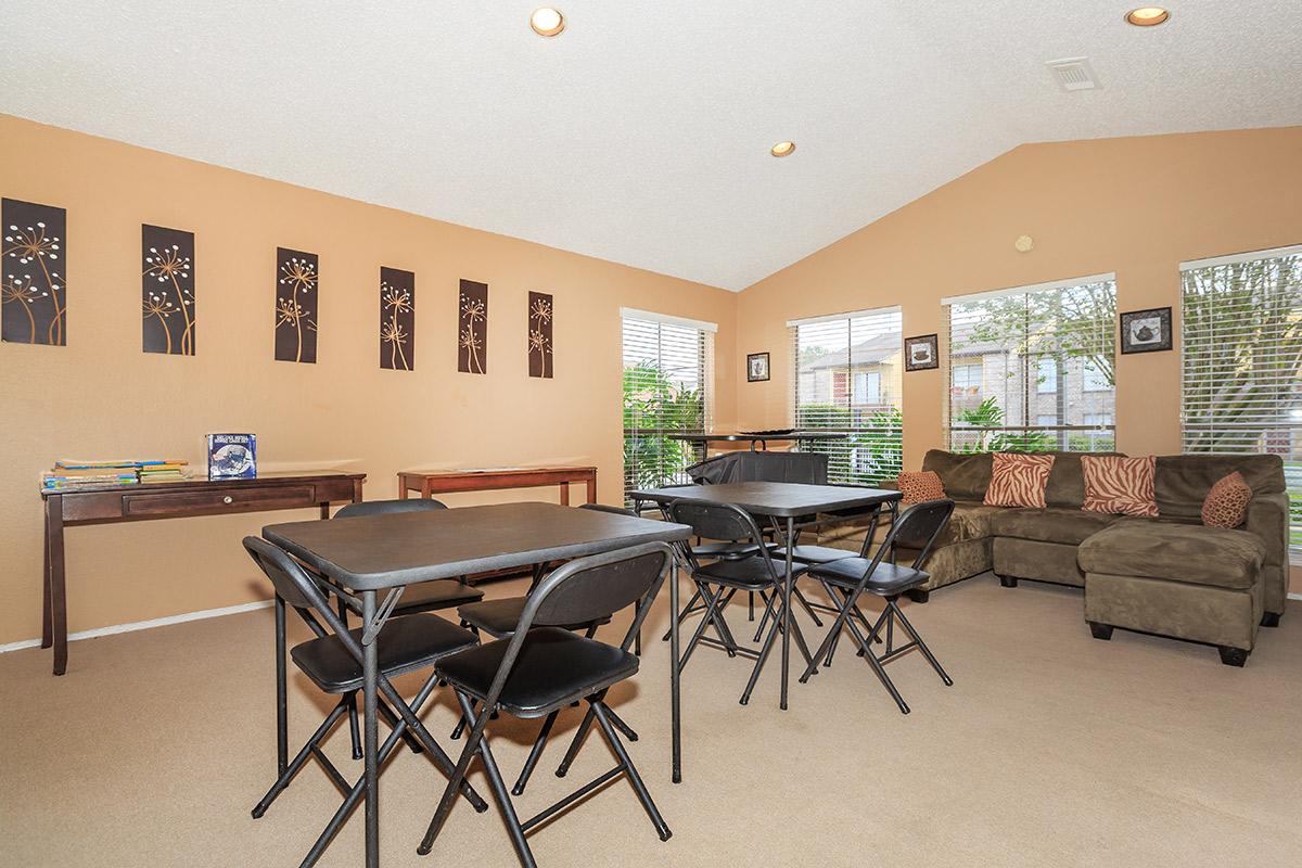 a living room filled with furniture and a table