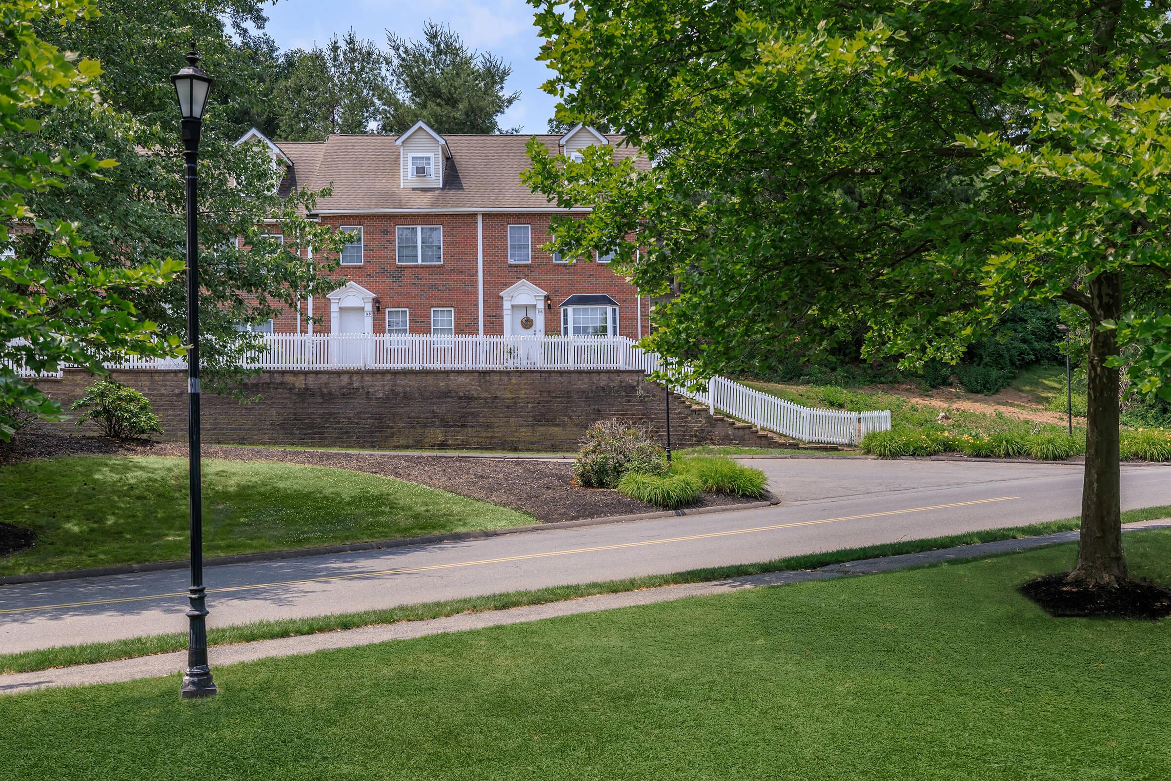 a tree in front of a house