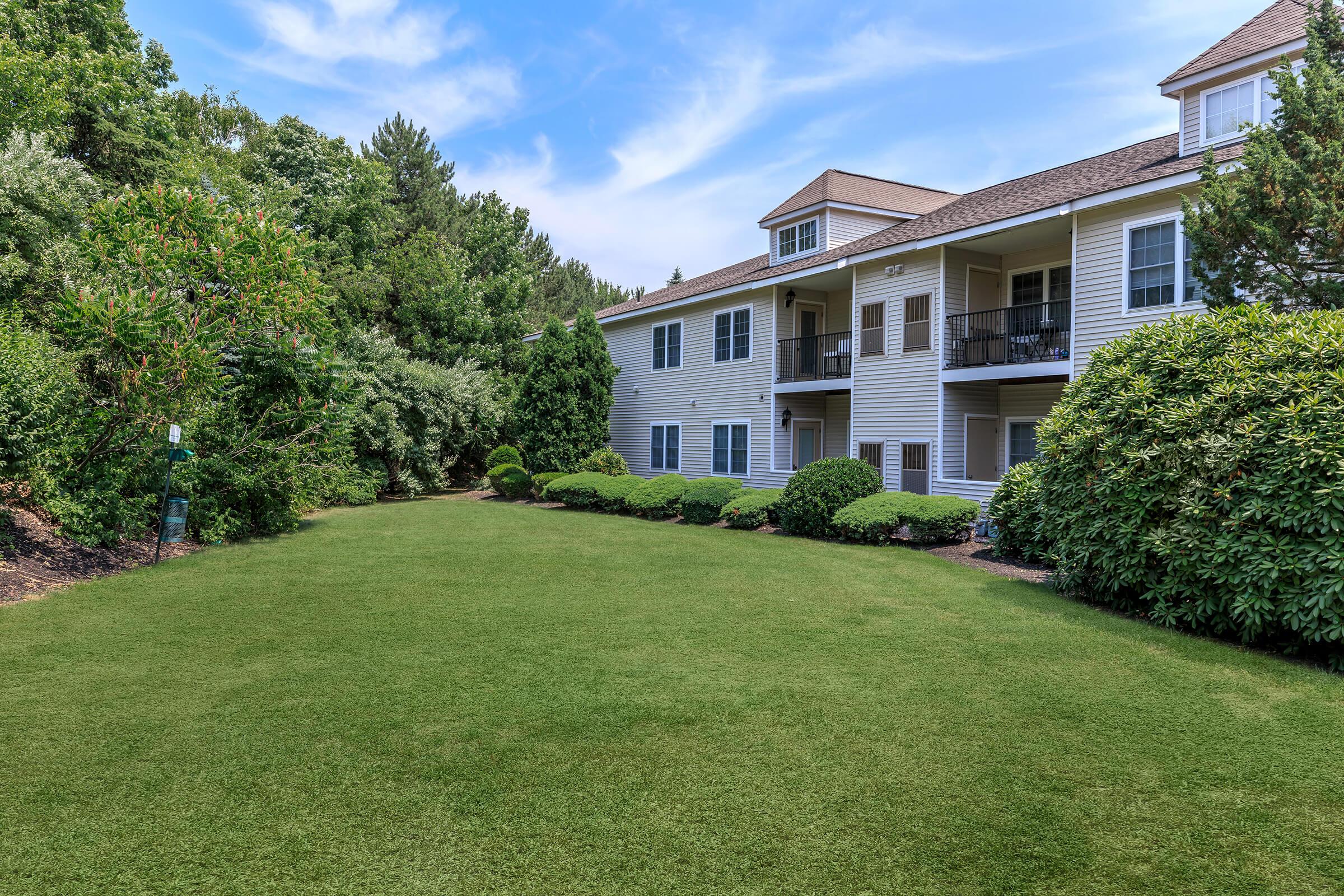 a large lawn in front of a house