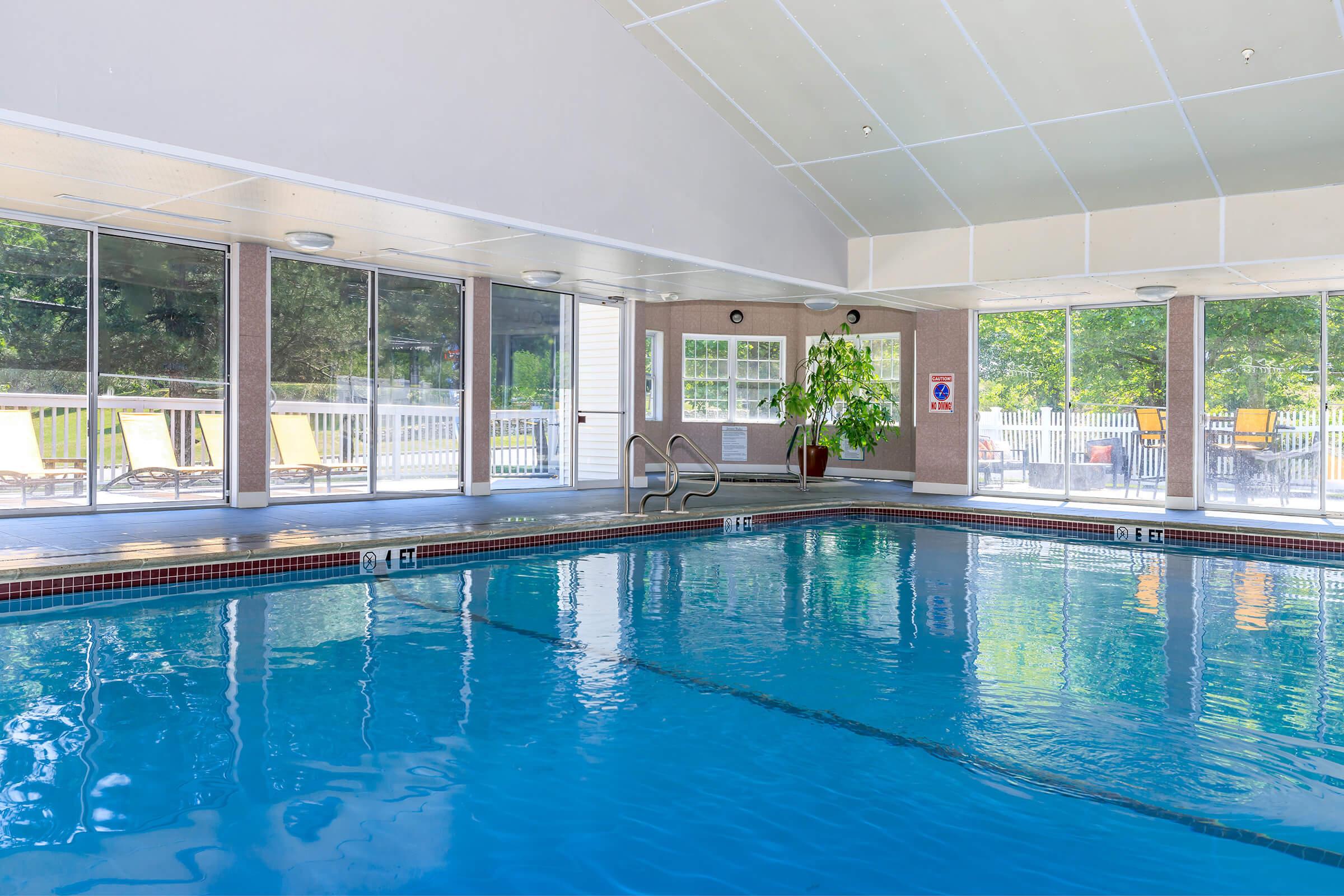 Dog-Friendly Apartments in Manchester, CT - The Manchester- Indoor Swimming Pool, with Floor-to-Windows, and Easy Access to Outdoor Patio Space