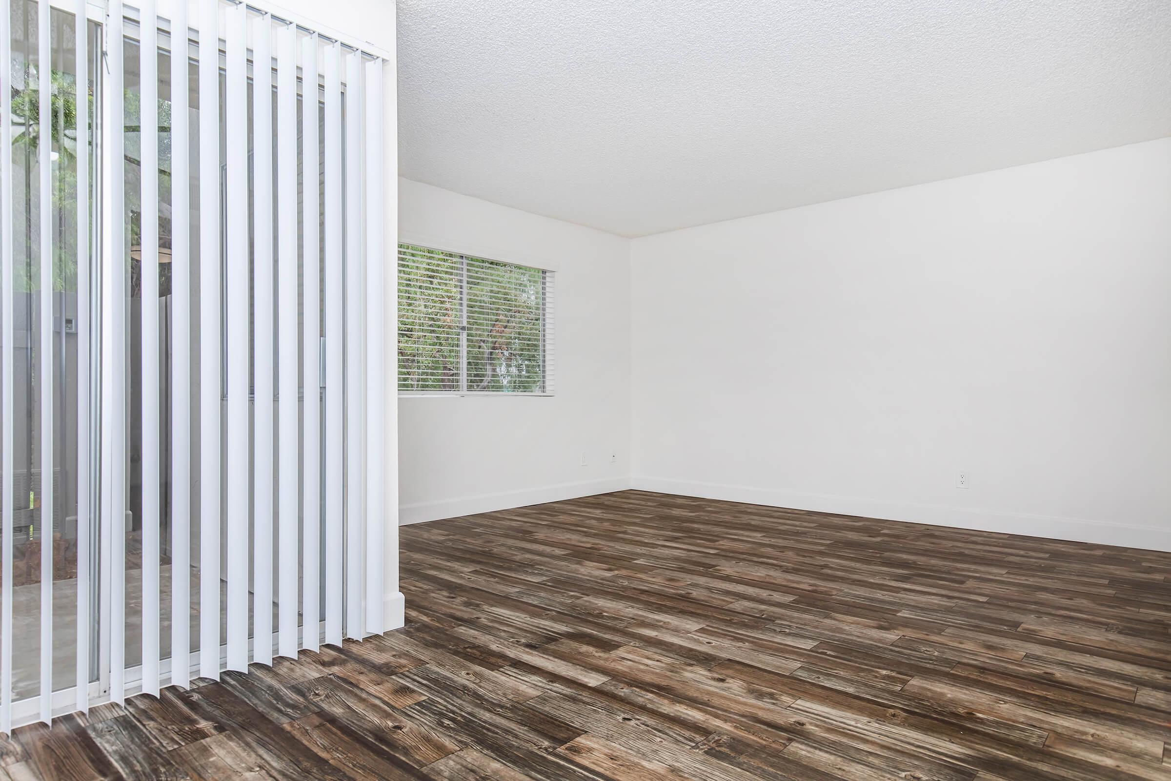 a bedroom with a building in the background