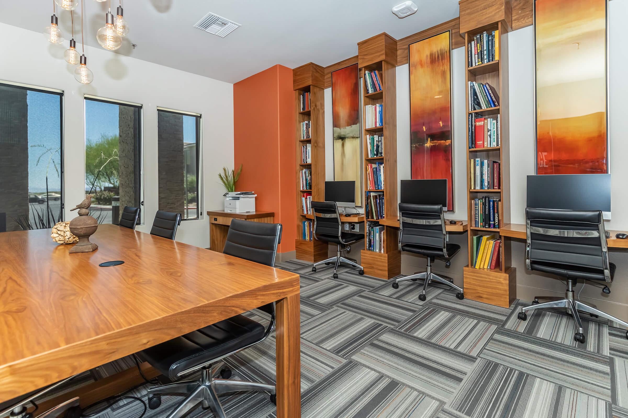 a room filled with furniture and a large window