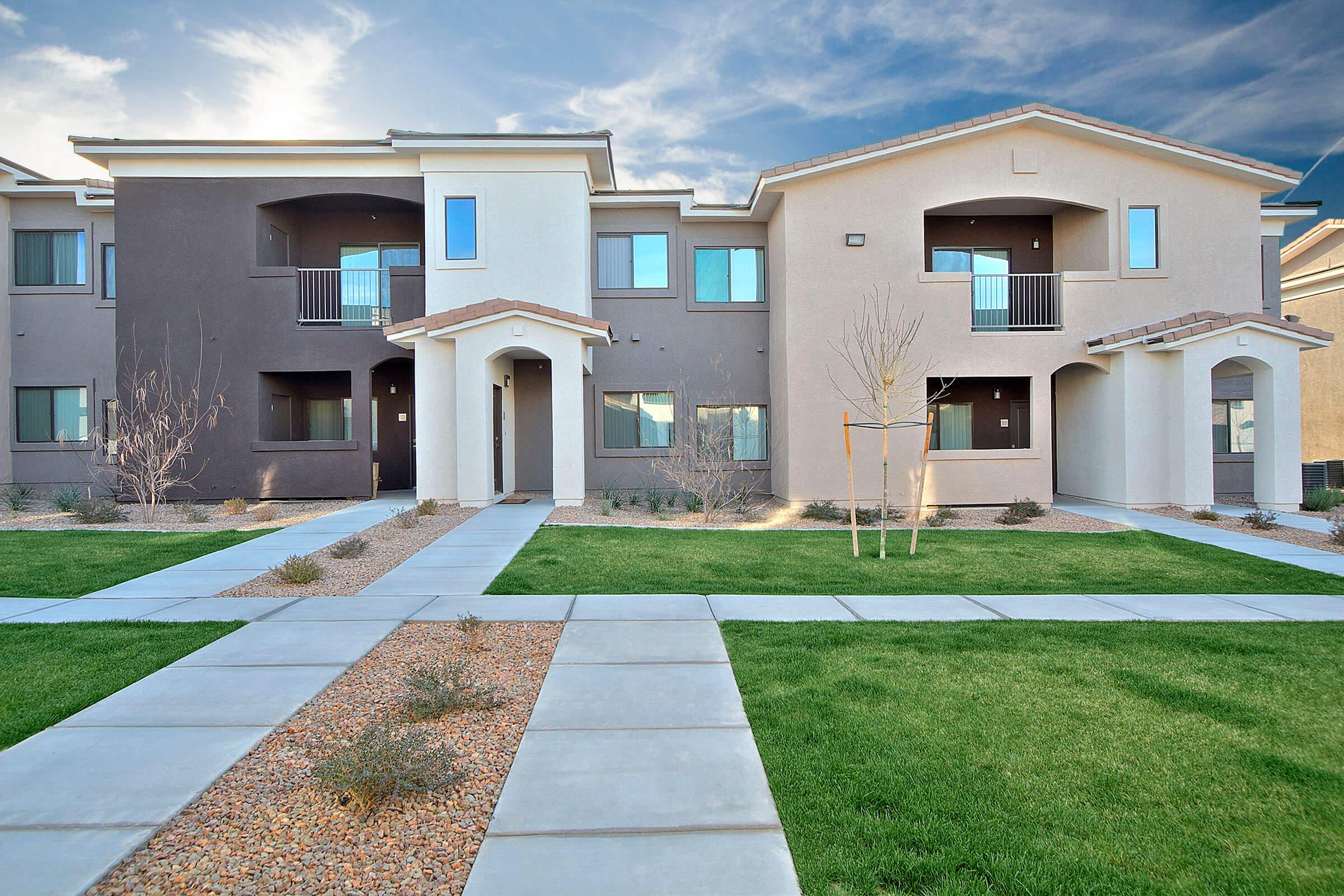 a house with a lawn in front of a building