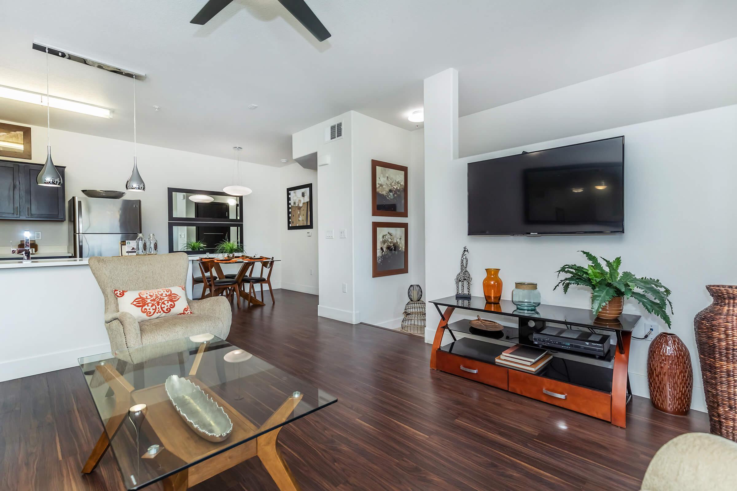 a living room filled with furniture and a table